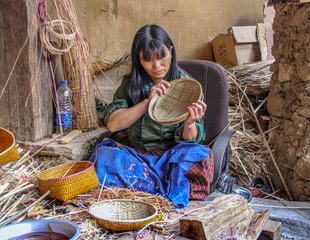 Basket maker in Nepal. by Laurie Bergner