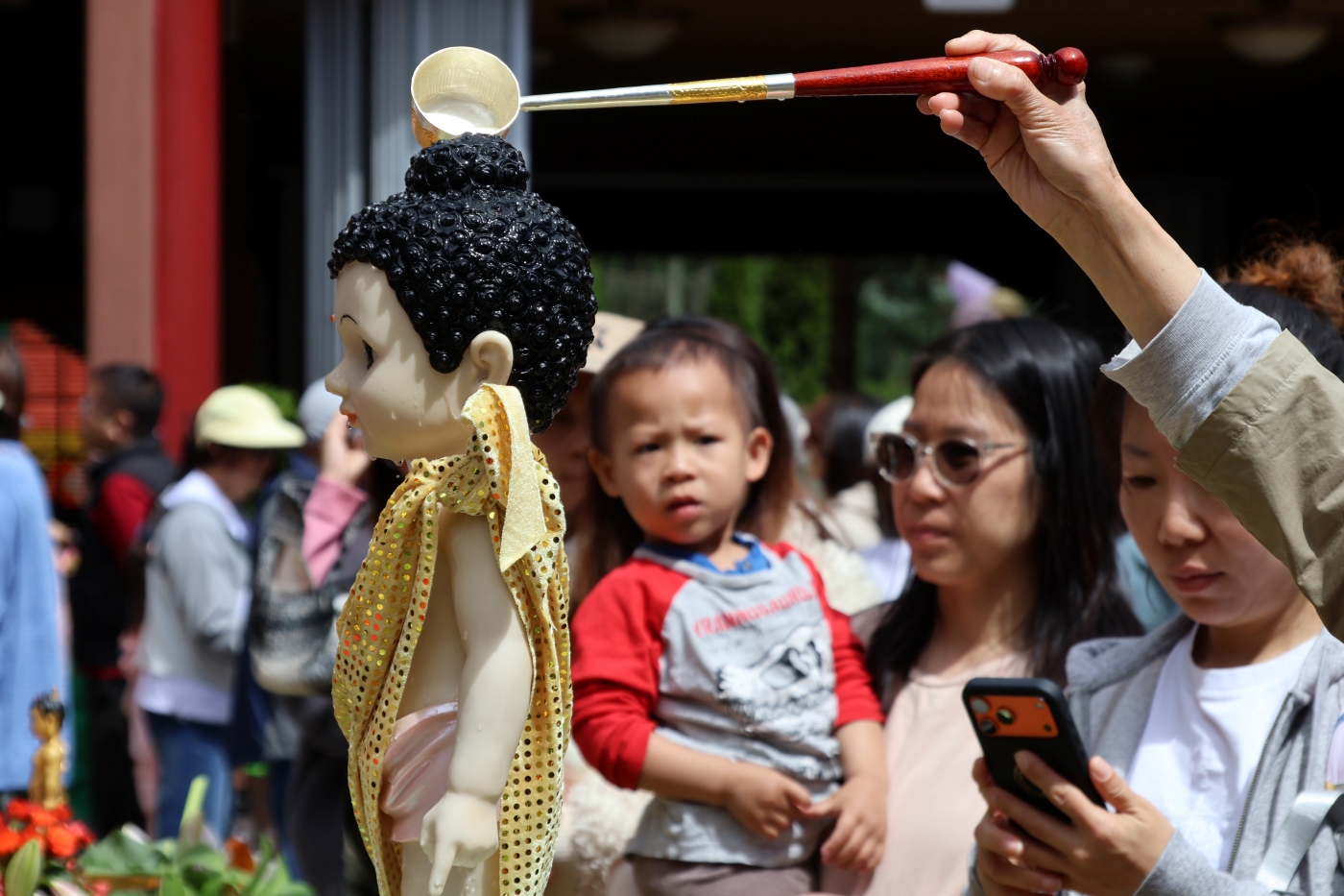 Eyes of Innocence in the Bathing Buddha Ceremony by Christine Wong