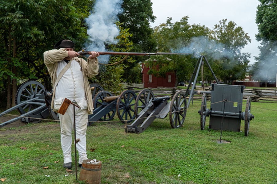 Firing a Musket in Colonial Williamsburg by Nancy Axelrod