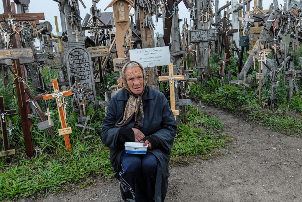Beggar at the Hill of Crosses, Lithuania by Tom Tauber, APSA, MPSA