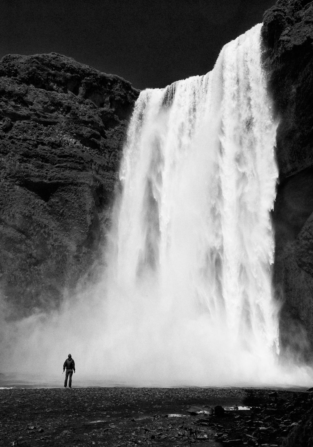Admiring Skogafoss, Iceland by Tom Tauber