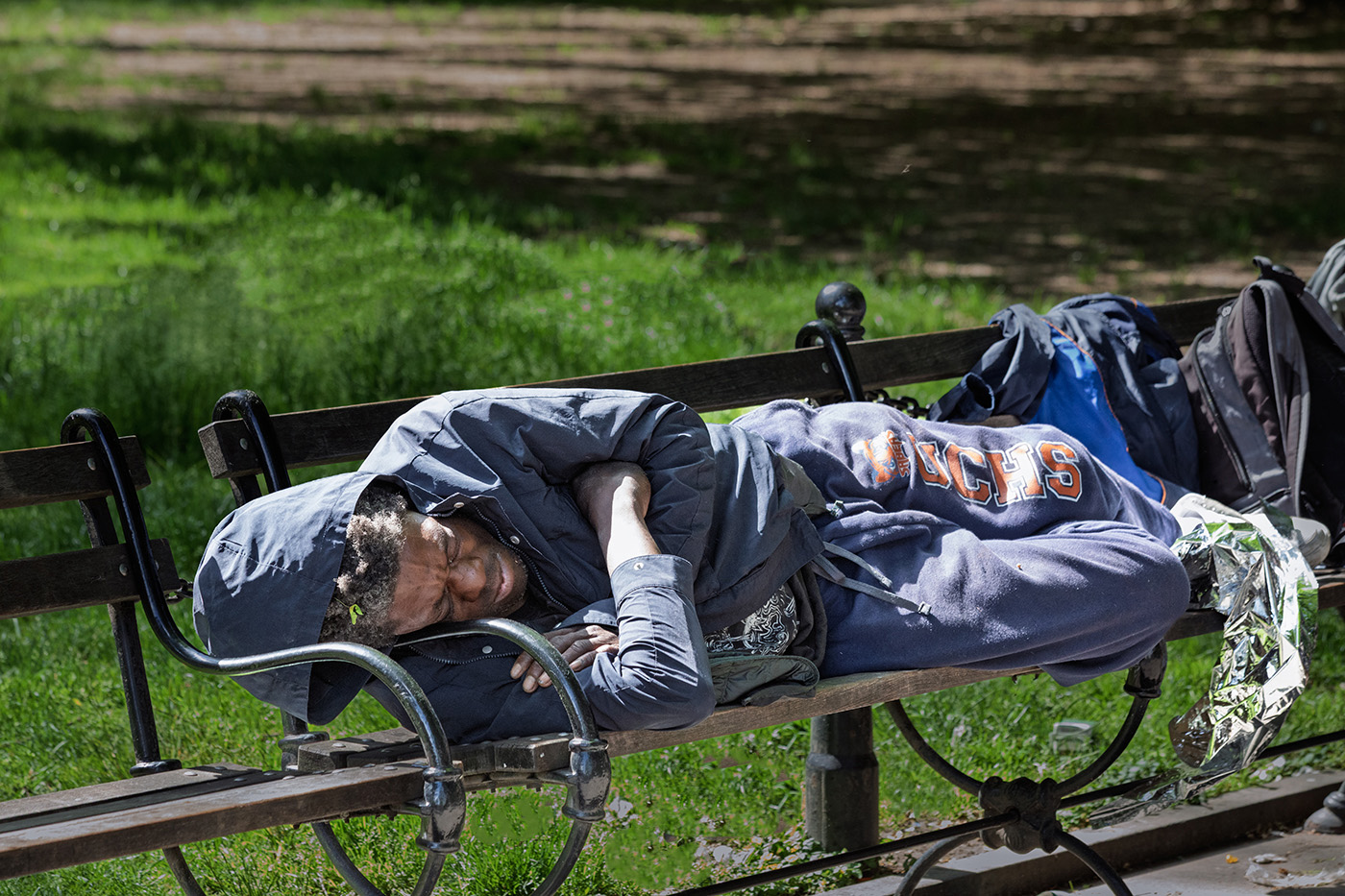 Man on park bench by Tom Brott