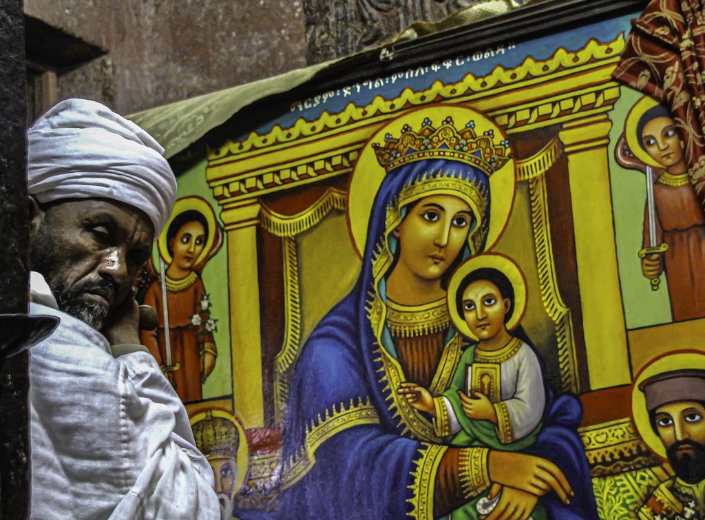 Ethiopian priest in Lalibela rock church.  by Laurie Bergner